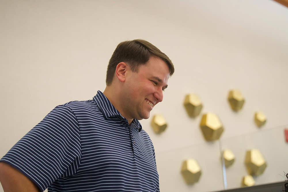 A Peoples Bank banker smiling during a conversation in the branch